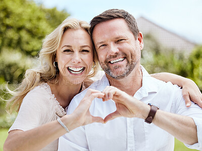 Buy stock photo Portrait, heart hands and happy couple outdoor for love, support or care emoji for relationship. Face, man and woman with sign for romance, loyalty and connection or laugh on valentines day in nature