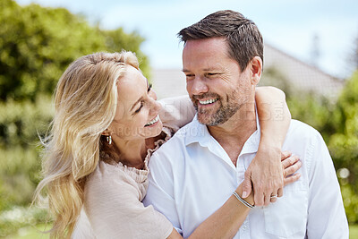 Buy stock photo Shot of an affectionate couple spending time outdoors