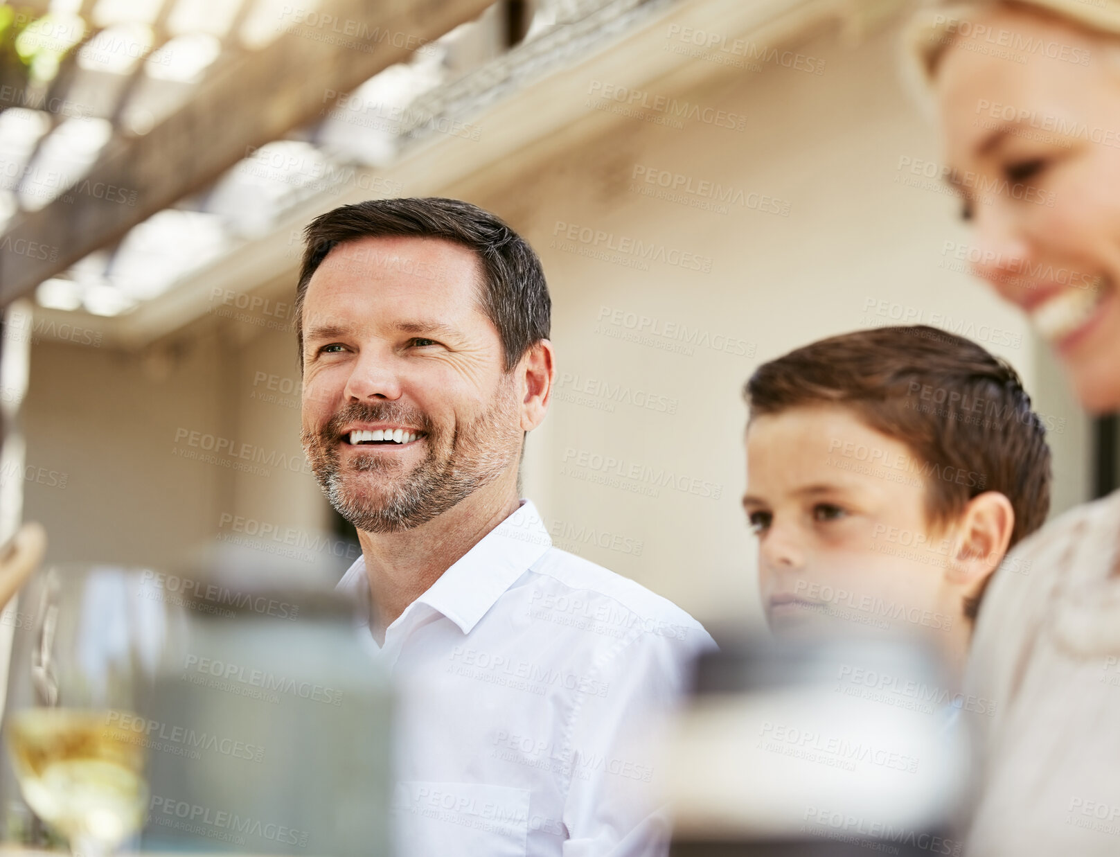 Buy stock photo Shot of a family enjoying a meal together