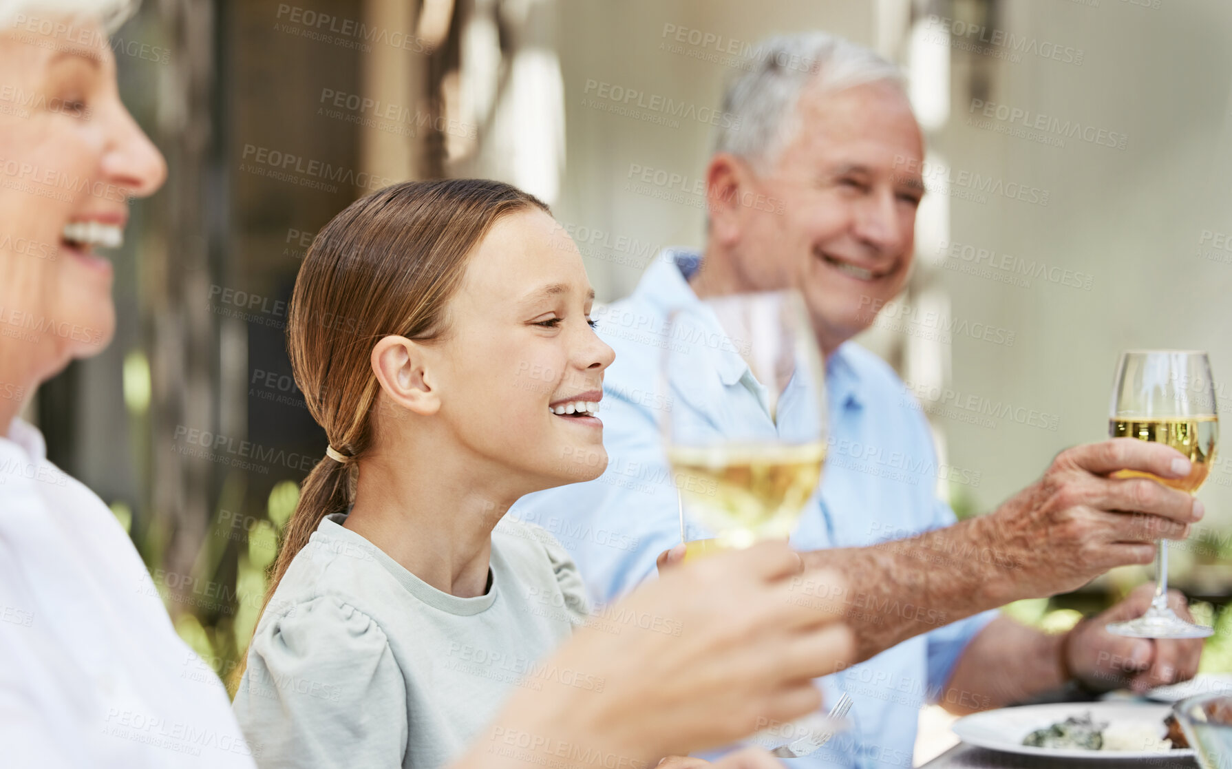 Buy stock photo Family, champagne and toast for celebration, food and gathering for thanksgiving, love and reunion. Outdoor, party and grandparents with wine, cheers and dinner in holiday, house and child with smile