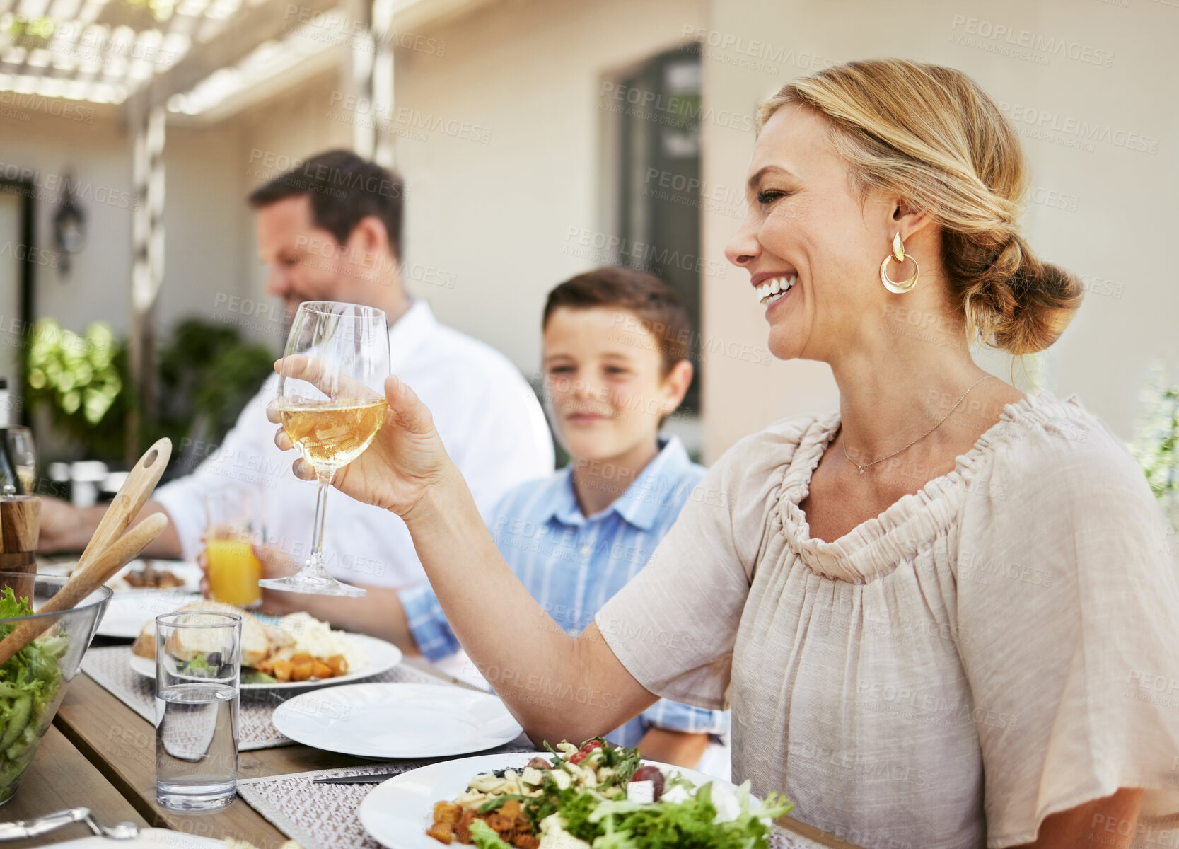 Buy stock photo Family, champagne and toast for celebration, woman and gathering for thanksgiving, love and reunion. Outdoor, party and parents with wine, cheers and dinner in holiday, house and child with smile