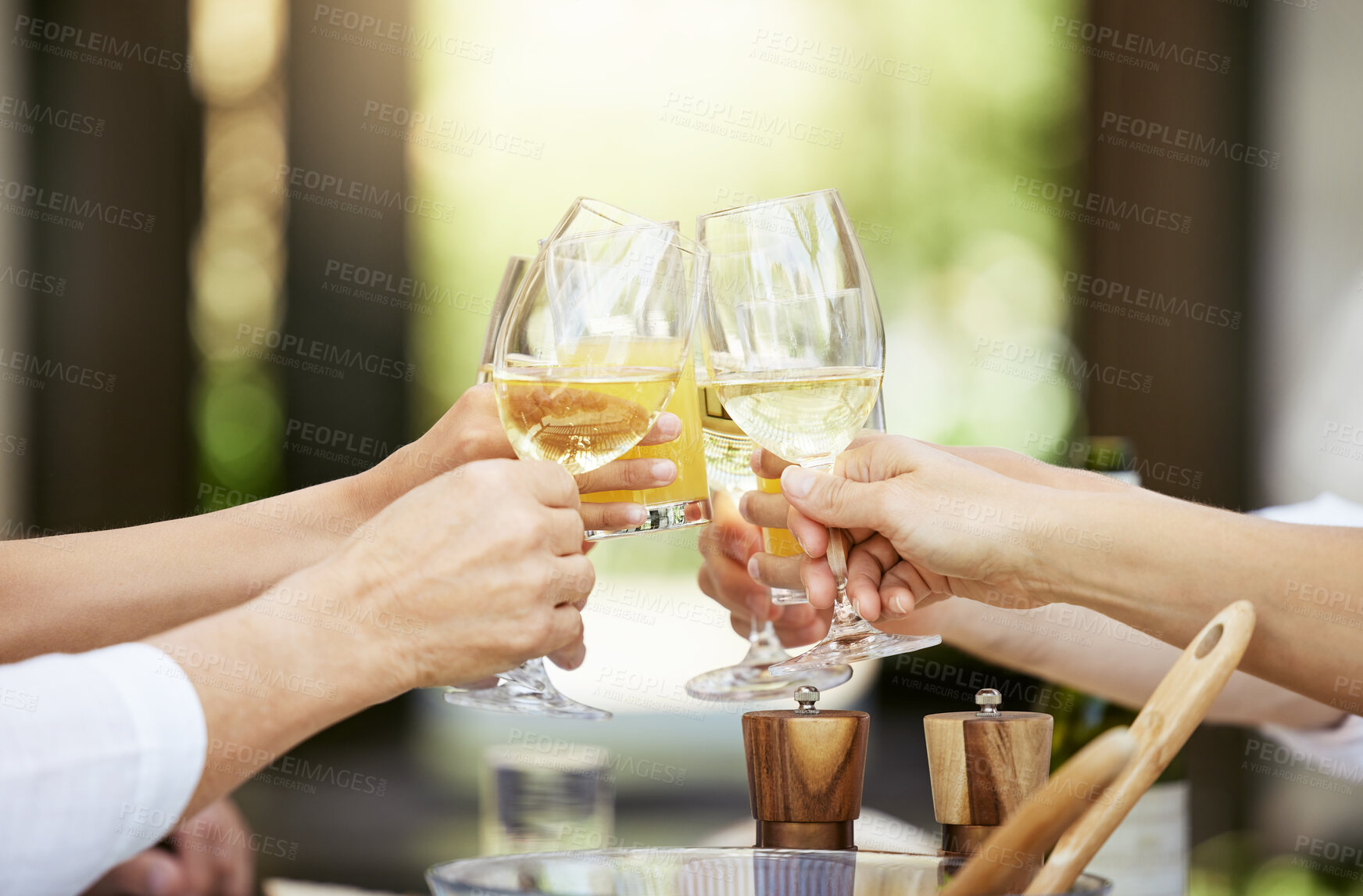 Buy stock photo Wine, cheers and food with hands of family in garden for Thanksgiving celebration, festive holiday and brunch. Support, love and party with people and toast for nutrition, grateful and tradition