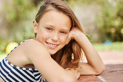 Buy stock photo Shot of an adorable little girl outside on a sunny day
