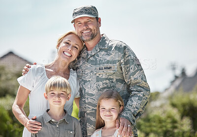 Buy stock photo Shot of returning soldier standing with his family outside