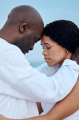 Buy stock photo Black couple, love and forehead touch at beach for care, trust and travel together on date. Man, woman and romance with eyes closed outdoor for connection, loyalty and commitment on summer holiday