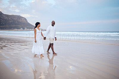 Buy stock photo Love, honeymoon and black couple holding hands at beach for support, trust or travel together on date. Smile, sea and people romantic anniversary for holiday, trip or marriage commitment in Mauritius