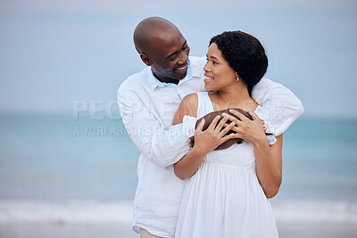 Buy stock photo Love, honeymoon and black couple hug at beach for support, trust or travel together on date. Smile, sea and happy people romantic anniversary for holiday, trip or marriage commitment in Mauritius