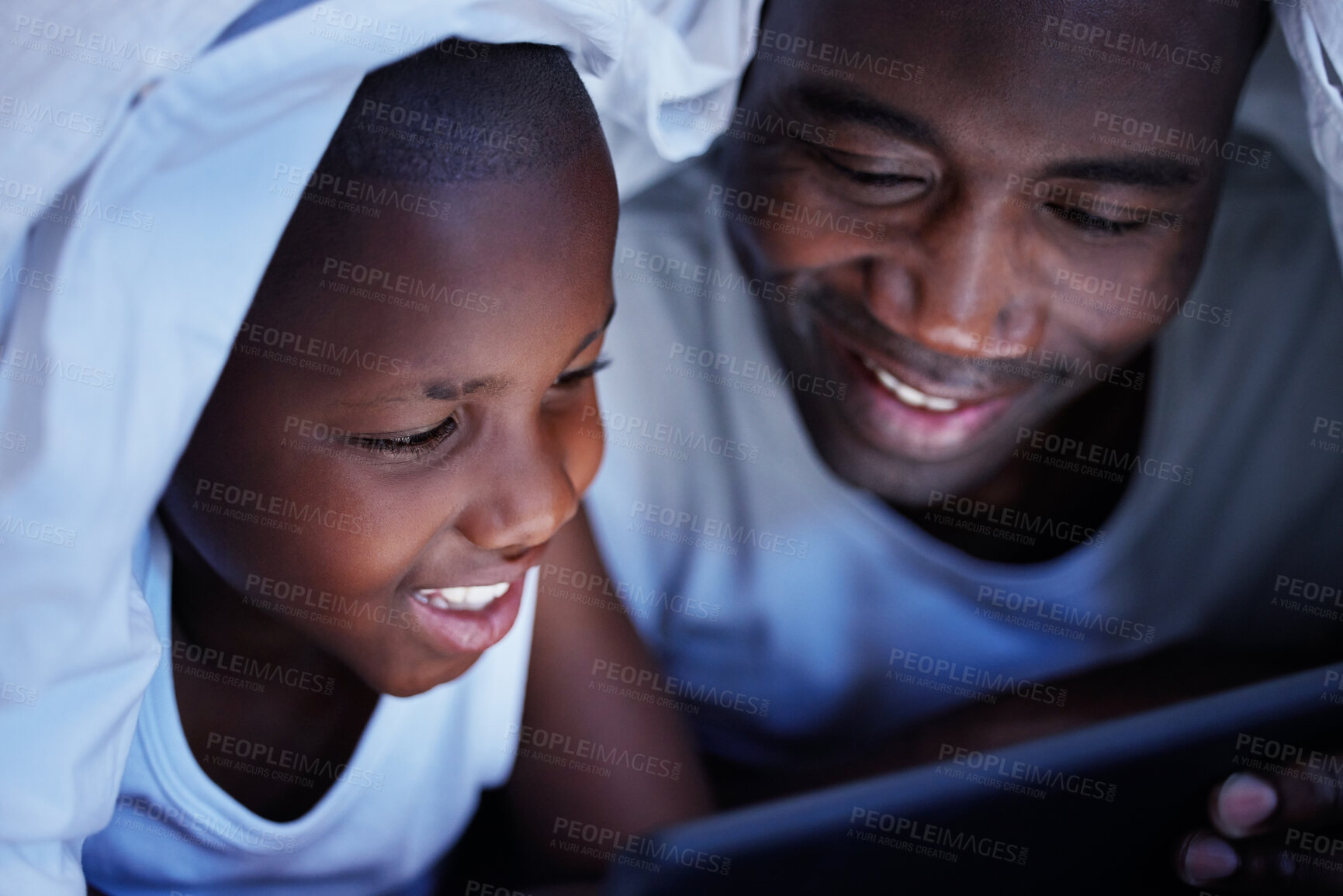 Buy stock photo Black family, night and dad with son, tablet and playing with blanket, social media and online game. African parent, boy and father in house, tech and internet with digital app and bonding together