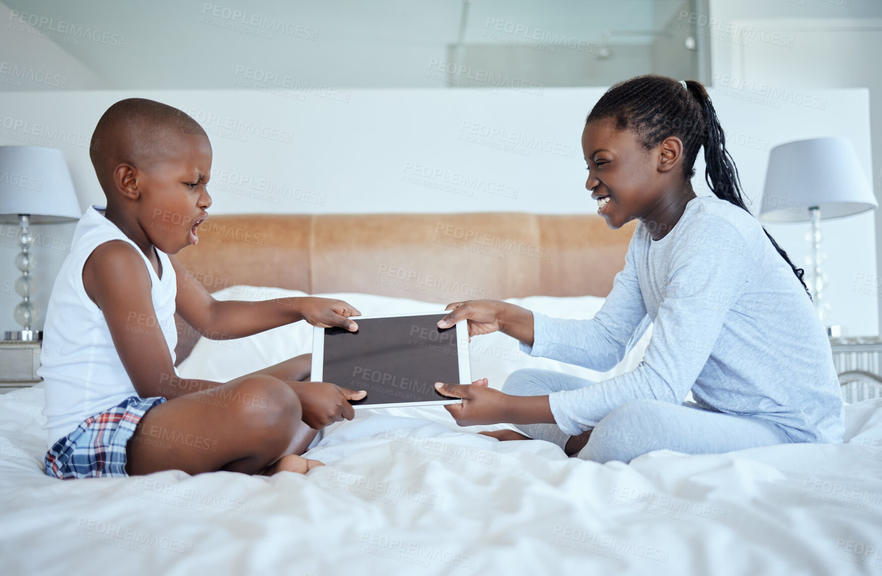 Buy stock photo Fight, angry or kids with tablet in home with bad behaviour, siblings rivalry or bullying in bedroom. Grab, aggressive family or African children with technology, touchscreen or tug of war conflict