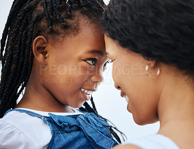 Buy stock photo Shot of a mother and daughter bonding at the beach