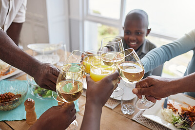 Buy stock photo Shot of a family toasting with wine glasses at home