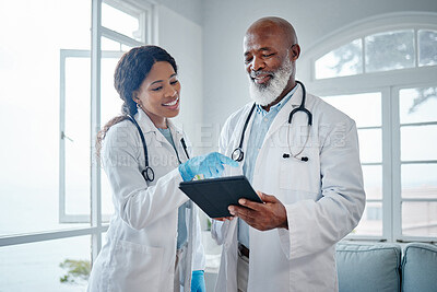 Buy stock photo African doctors, teamwork and talk with tablet, data analysis or learning for healthcare in hospital. Senior black man, woman or medical mentor on touchscreen for research with wellness app in clinic