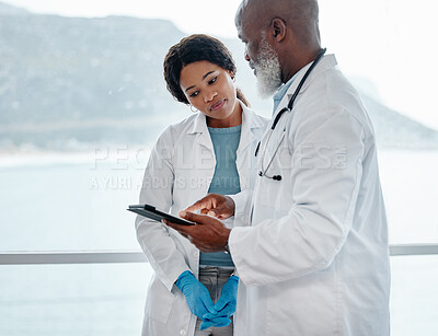 Buy stock photo African doctors, teamwork and talking with tablet, data analysis or results for healthcare in hospital. Senior black man, woman and medical discussion with digital touchscreen for wellness in clinic