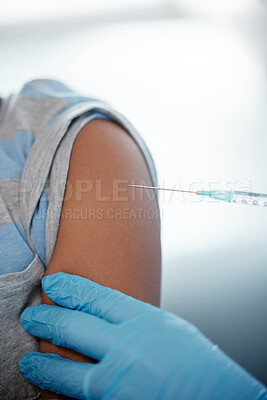Buy stock photo Closeup shot of an unrecognisable boy getting an injection on his arm from a doctor