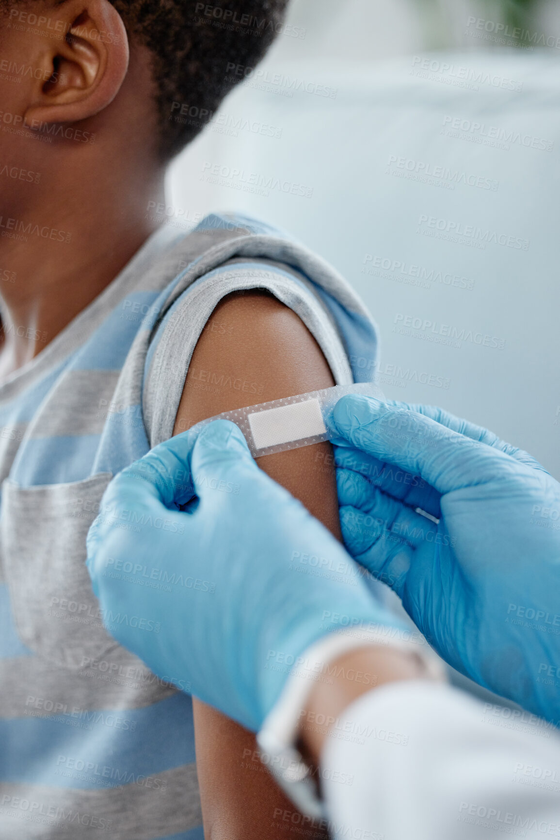 Buy stock photo Healthcare, black child and plaster on arm for vaccine, injection site or hands of doctor in clinic. Kid, care or bandage on skin for healing, medicine or support in hospital for health or protection