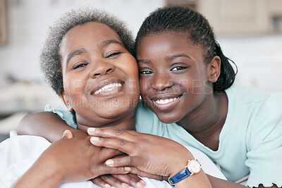 Buy stock photo Shot of a girl and her grandma bonding at home