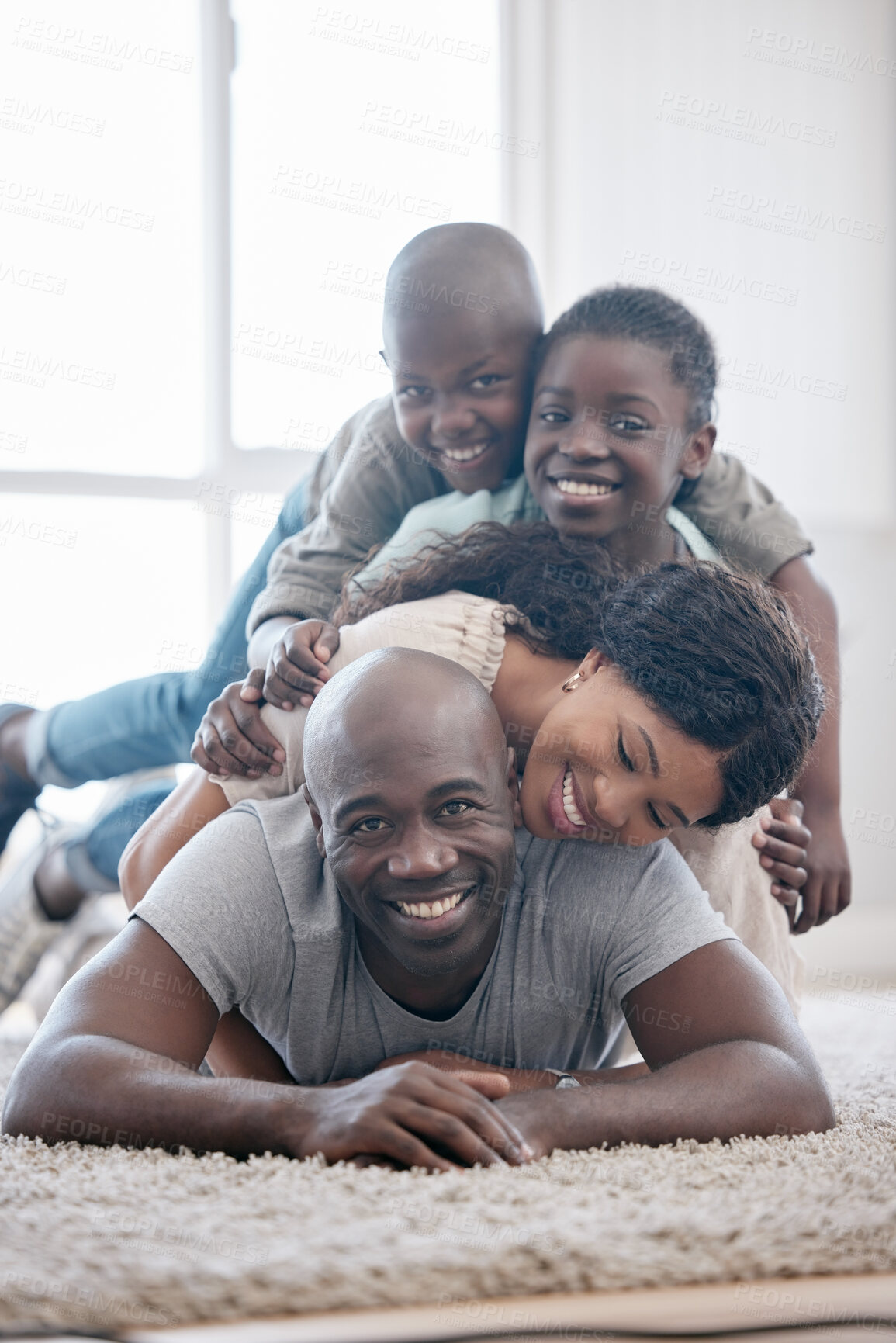 Buy stock photo Black family, portrait and happy on floor in home with support, bonding and relationship with love, care and security. People, parents and kids on carpet with relax, break and holiday fun together