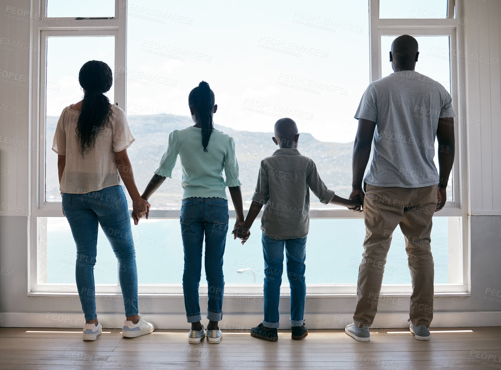 Buy stock photo Family, love and window in dream home for moving, relocation and lounge. Support, trust and parents back holding hands of children in house with scenic view, bonding and summer vacation or holiday