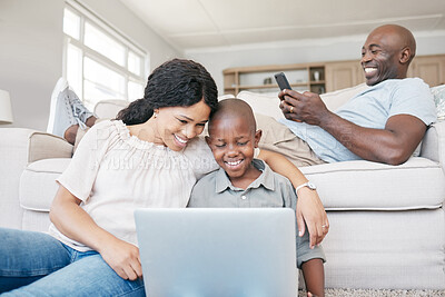 Buy stock photo Shot of a family using electronic devices at home