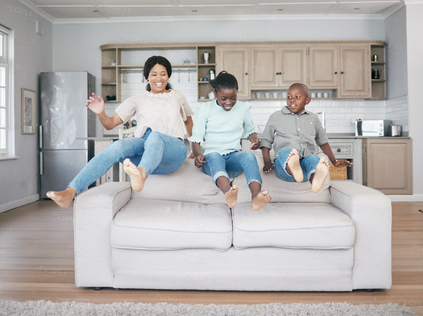 Buy stock photo Black family, couch and kids jump in home with mother, love and girl together with fun and game. Bonding, lounge and bonding with in air, care and support on weekend with happy in morning with youth