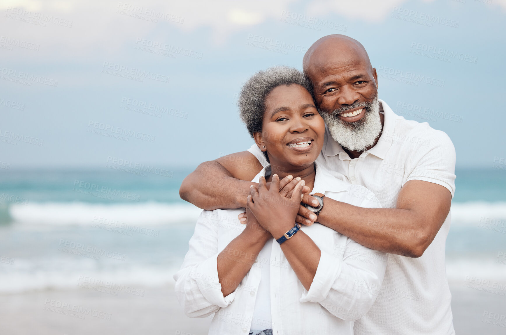 Buy stock photo Shot of a mature couple spending time at the beach