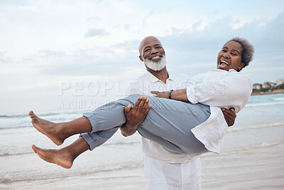 Buy stock photo Happy, portrait and senior black couple on beach for travel, vacation or getaway with bonding. Love, excited and elderly man carrying wife by ocean or sea for retirement holiday together in Morocco.