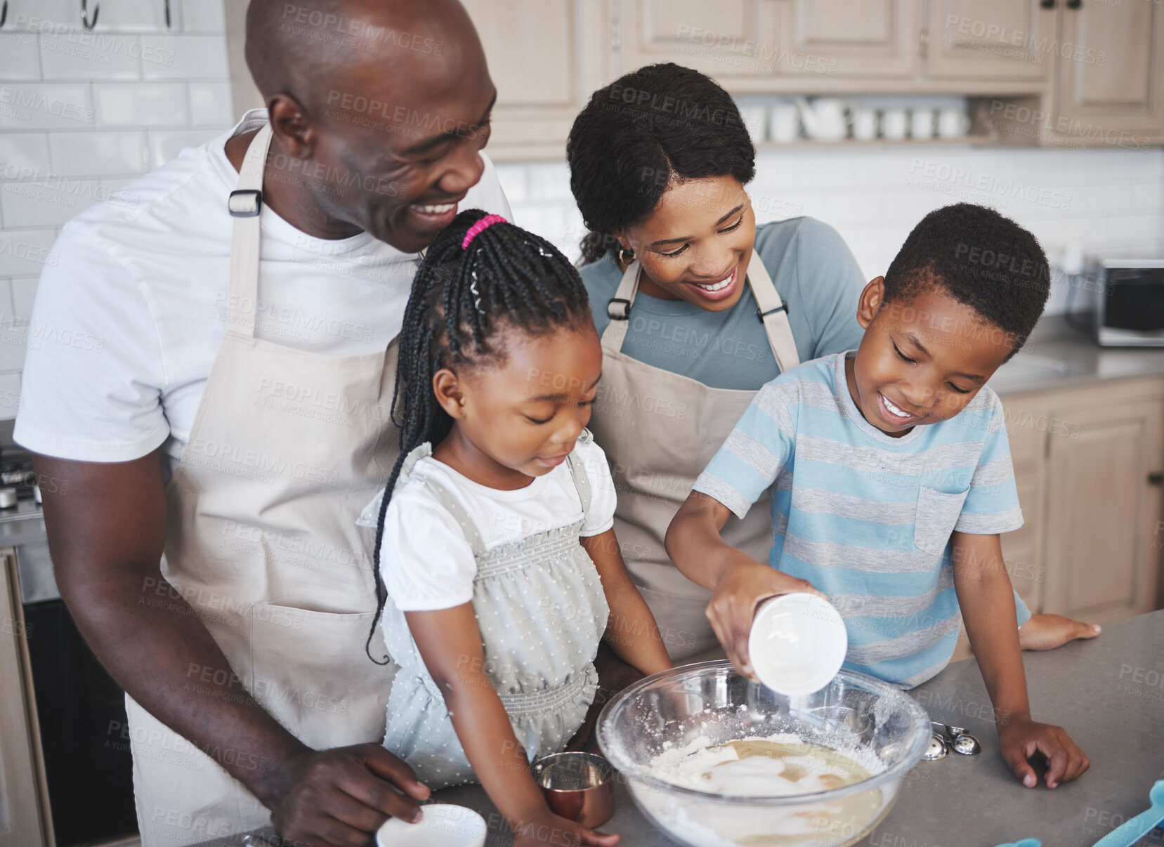 Buy stock photo Baking, happy and black family in kitchen for bonding, learning and skill development in home. Mixing bowl, ingredients and African parents teaching children to cook for growth and fun at house.