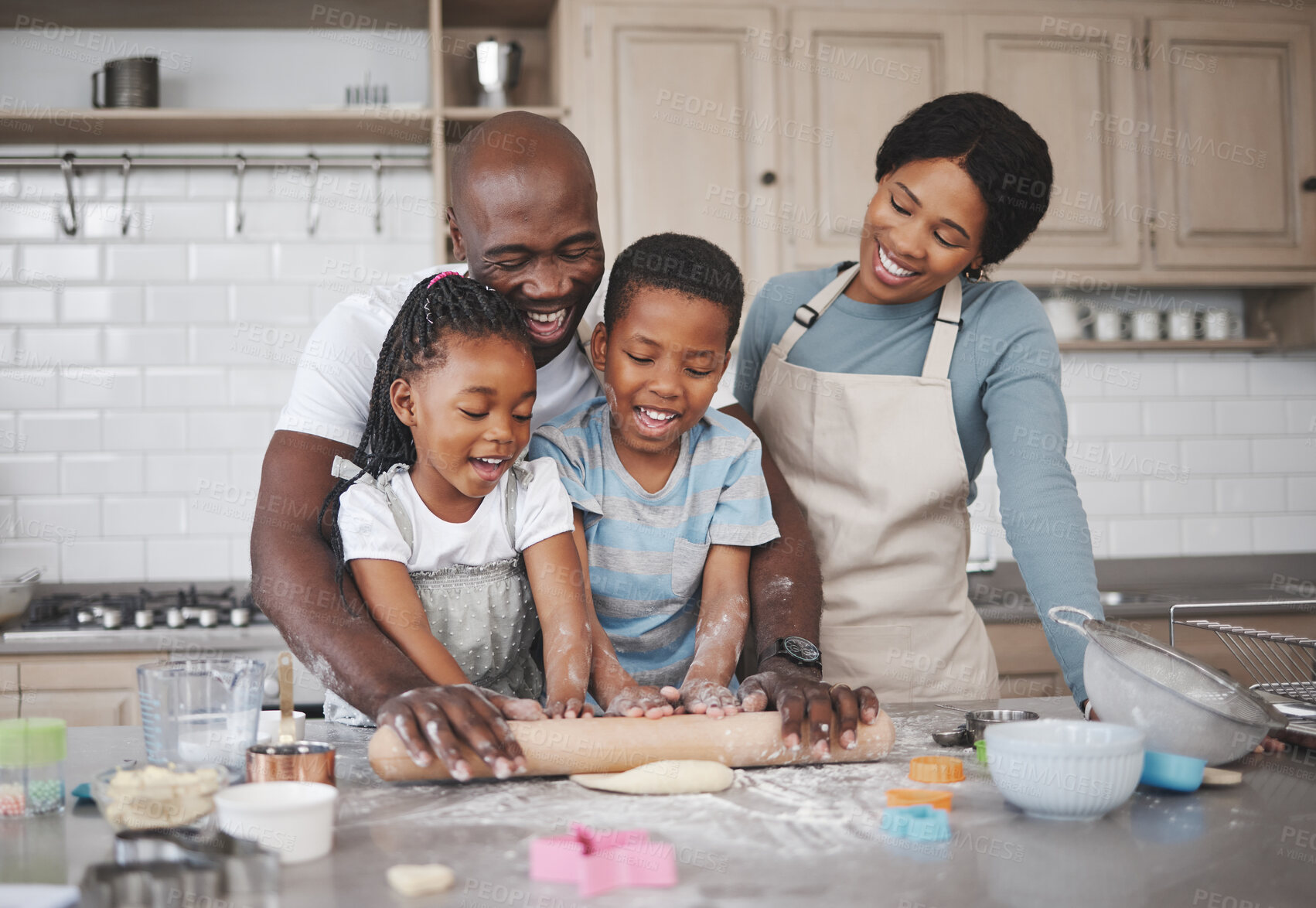 Buy stock photo Shot of a family baking together in the kitchen