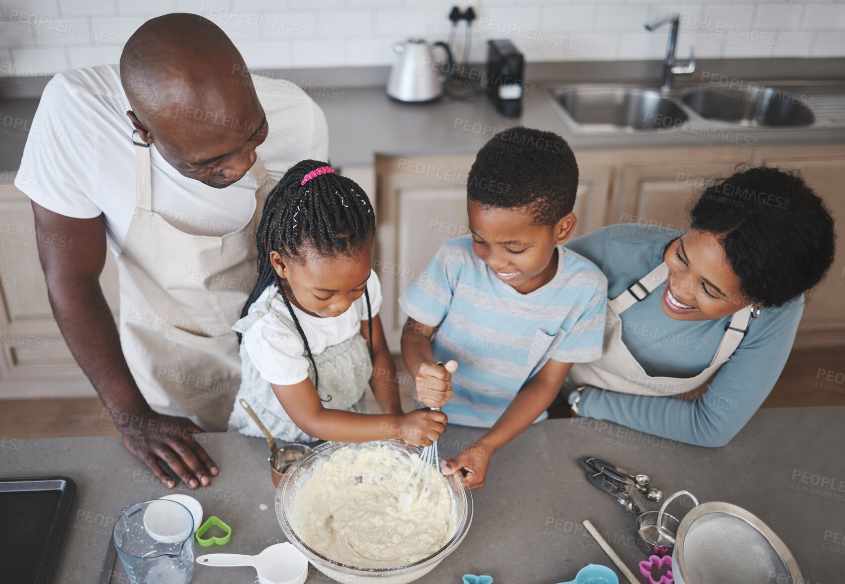 Buy stock photo Whisk, bowl and black family baking in kitchen for bonding, learning and skill development in home. Mixing, ingredients and African parents teaching children to cook for growth and fun at house.