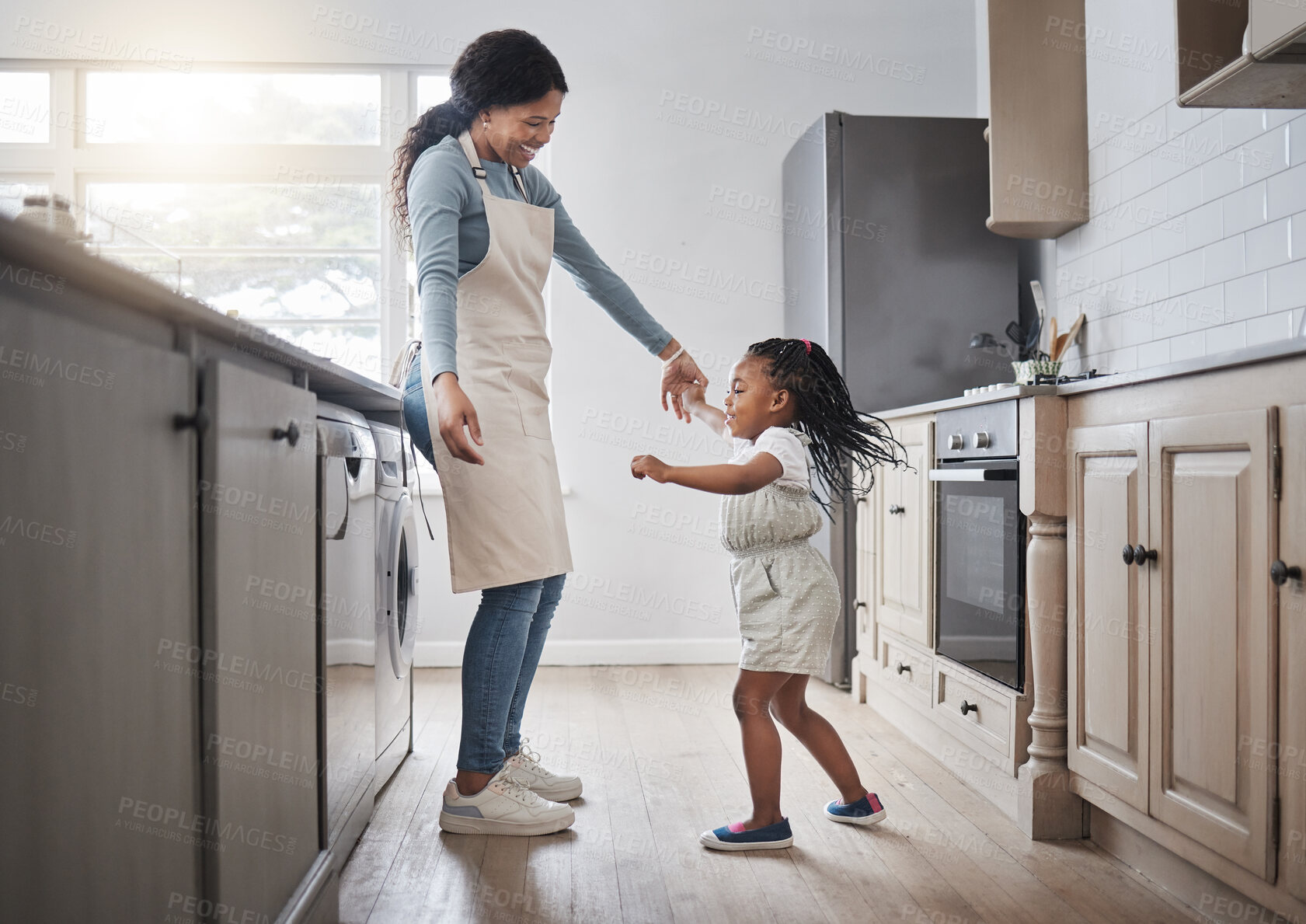 Buy stock photo Dance, love or smile with mother and daughter in kitchen of home together for bonding or playful fun. Black family, energy or music with girl child and single parent woman in apartment on weekend 