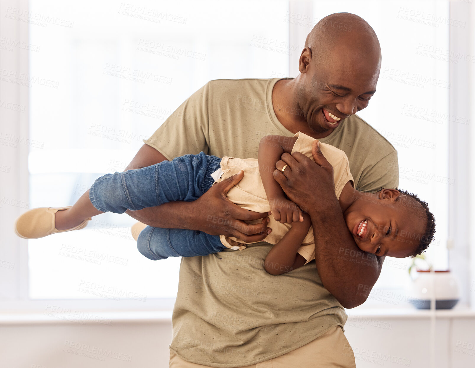 Buy stock photo Shot of a father and son spending time together at home