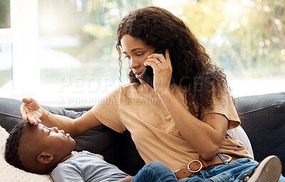 Buy stock photo Shot of a young mother on a call while taking care of her sick son at home
