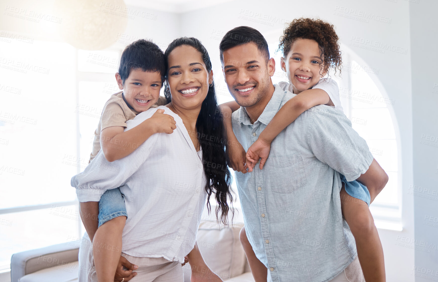 Buy stock photo Portrait, parents and piggyback children in home for childhood fun, playful and bonding with love or care. Mother, father and siblings in living room of house with happiness for family time and relax