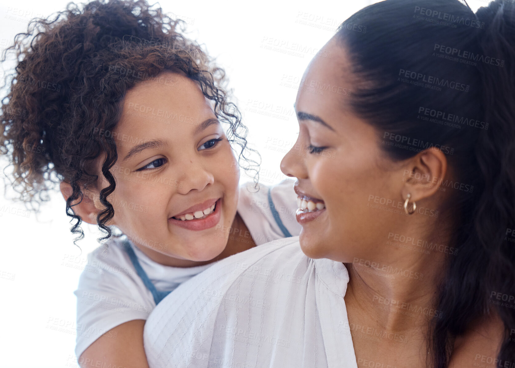 Buy stock photo Shot of a little girl bonding with her mother at home