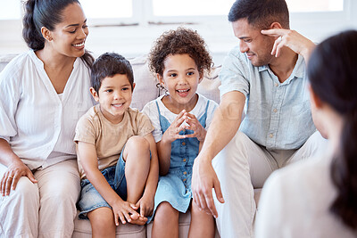 Buy stock photo Parents, kids and counselling with psychology, smile and together on sofa, support and discussion. Young family, children and happy on couch with psychologist, listening and talking for mental health