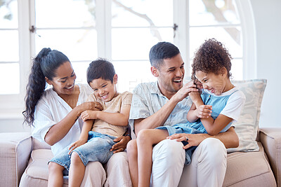 Buy stock photo Shot of parents tickling their little children at home