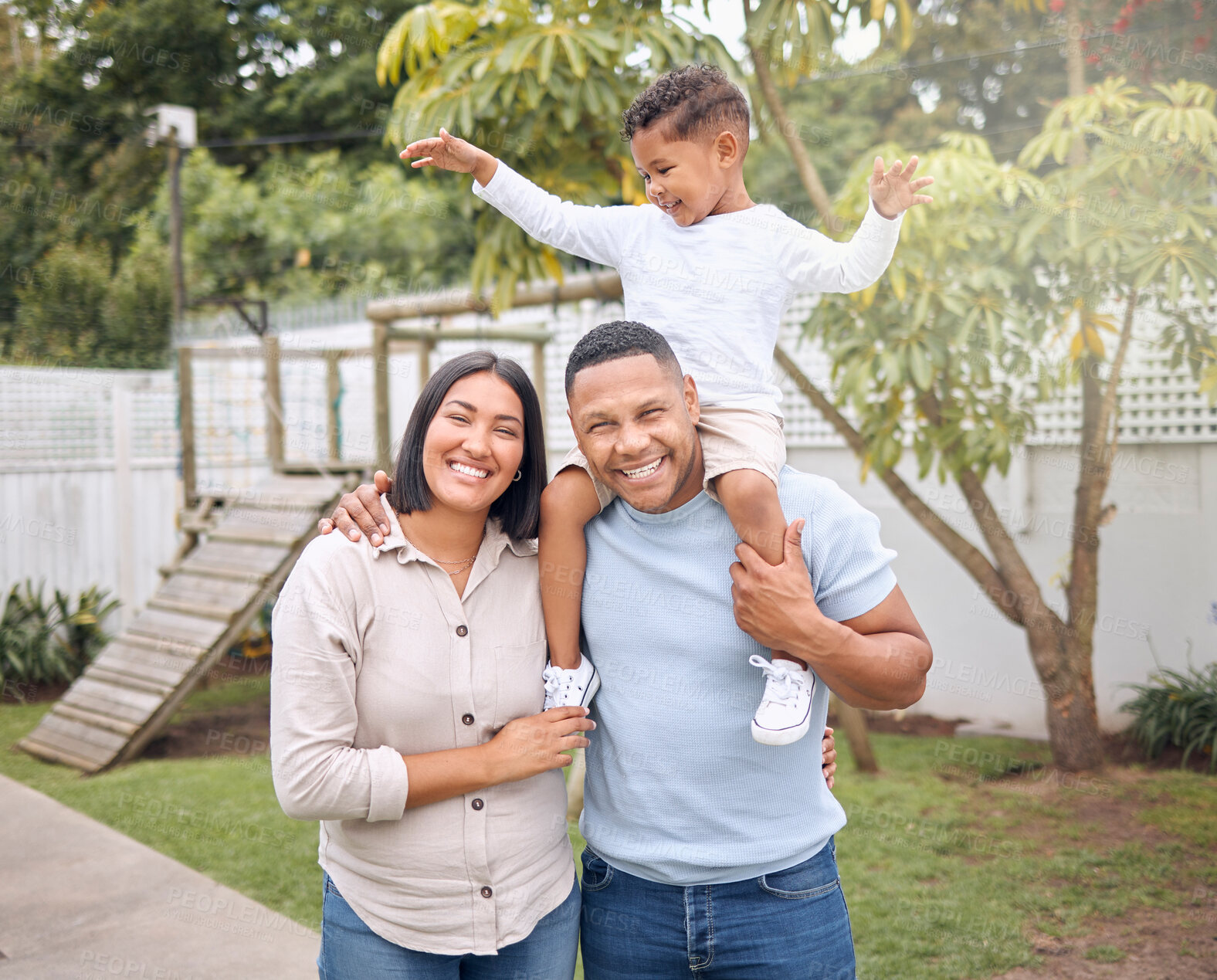 Buy stock photo Parents, smile and child on shoulders outdoor with hug for game, family bonding and support of love in backyard. Happy, woman and man with boy for trust, security and care  together in nature