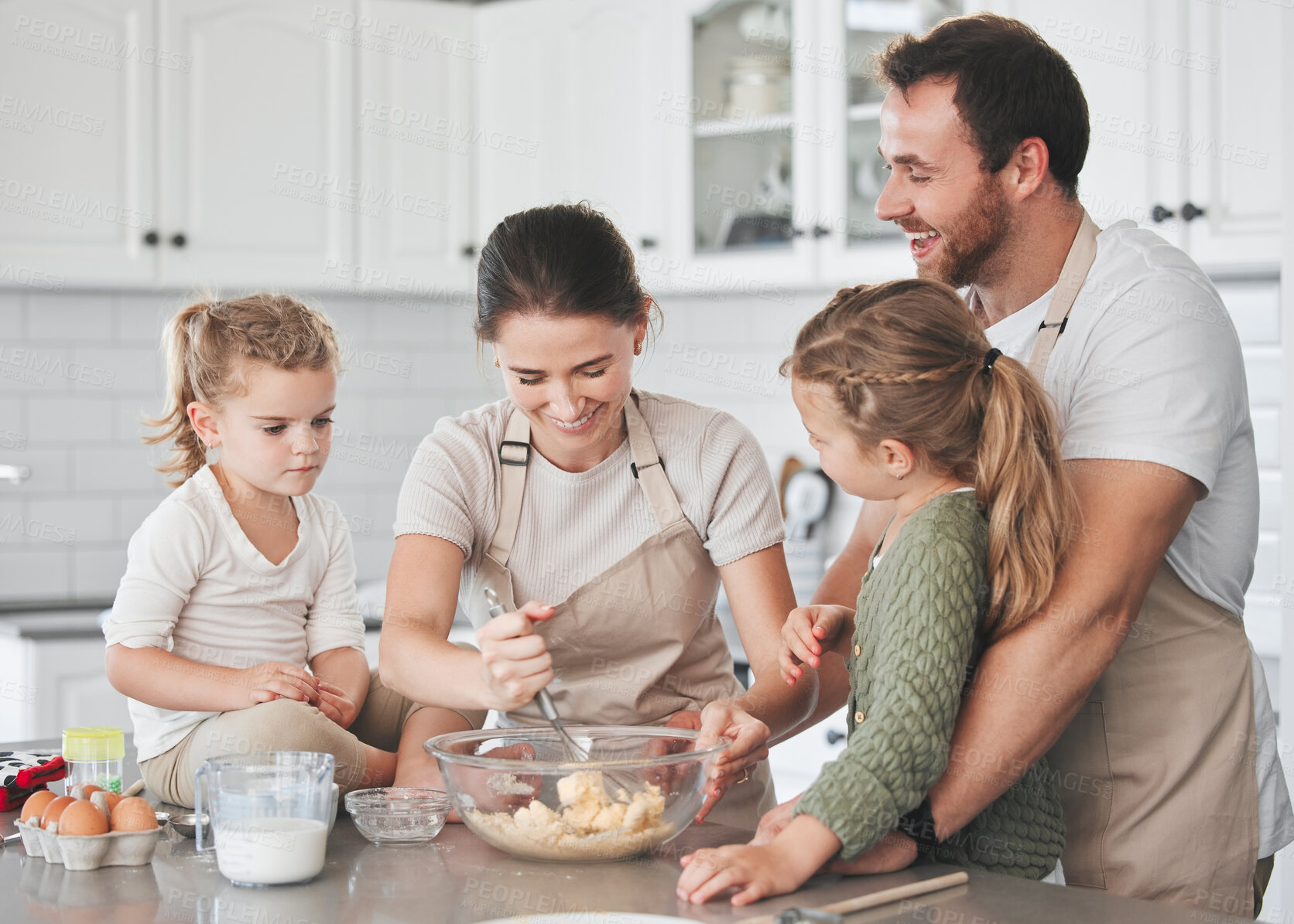 Buy stock photo Baking, morning and parents with kids in kitchen for learning chef skills, development and bonding together. Family, home and happy mom, dad and girls with ingredients for cake, treats and dessert