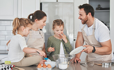 Buy stock photo Baking, happy and parents with children in kitchen for learning chef skills, development and bonding. Family, home and mom,. dad and girls with ingredients and recipe for cake, treats and dessert