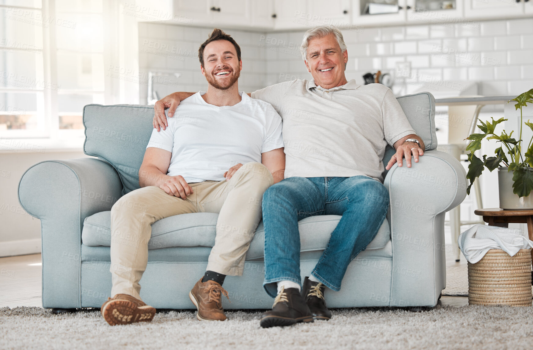Buy stock photo Portrait, senior father and man on sofa for laughing, connection and bonding together with hug in home. Happy family, elderly dad and adult son on couch with smile, support and security in house