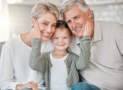 Buy stock photo Shot of a happy senior couple and their granddaughter  relaxing on the sofa at home