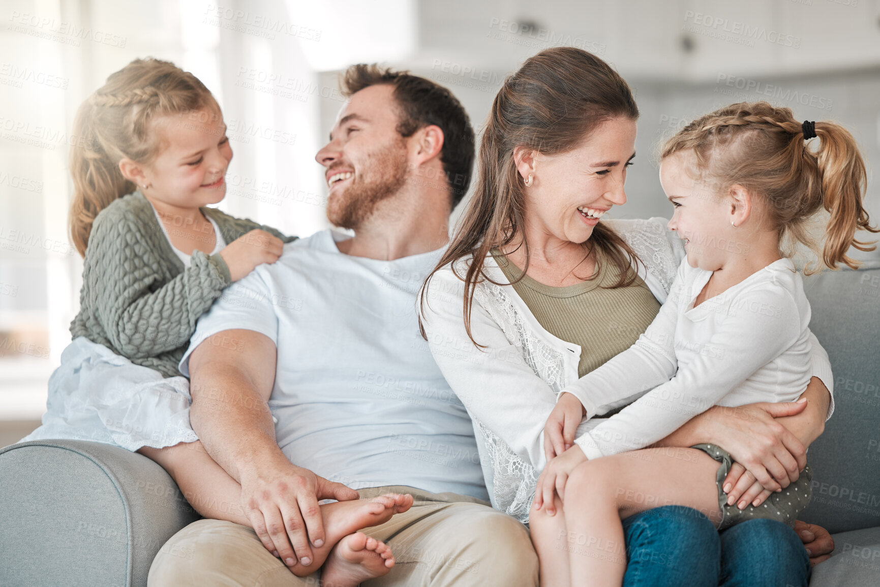 Buy stock photo Family, smile and love in house for relax, care and happiness on sofa with joy, embrace and fun. Parents, hug and people with children for connection, bonding and support together in lounge on couch