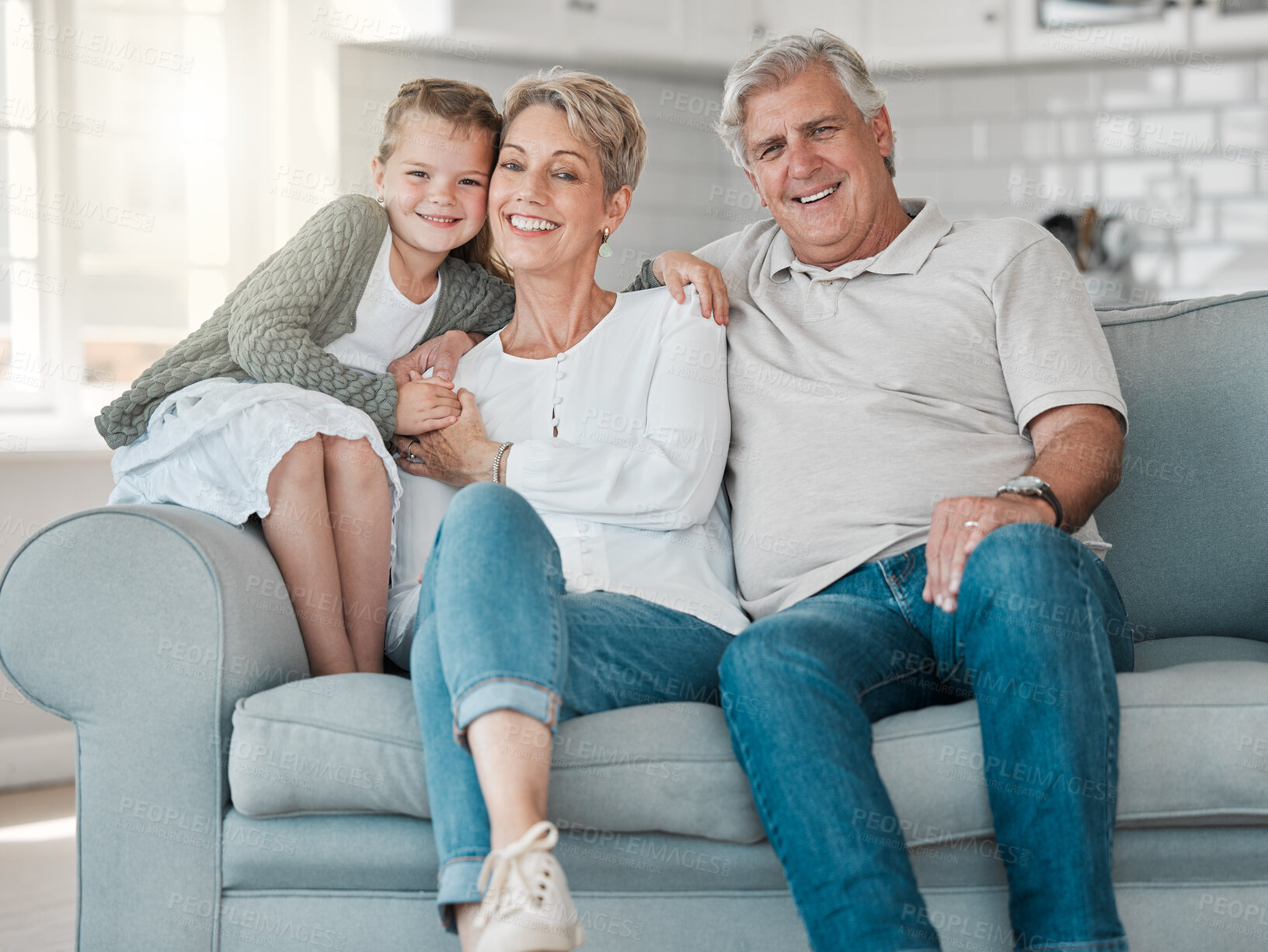 Buy stock photo Happy, relax and portrait of child with grandparents in home for bonding, connection and family time. Smile, love and girl kid on sofa with senior man and woman in living room at house in Australia.