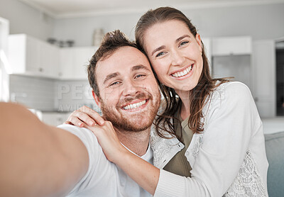 Buy stock photo Portrait of a young couple relaxing on a sofa at home