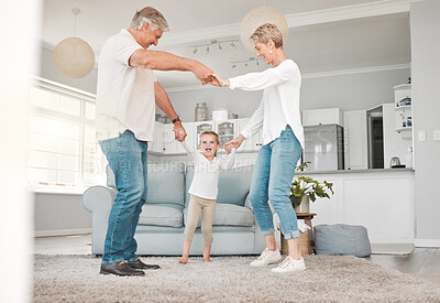 Buy stock photo Happy grandparents, dancing and bonding with grandchild for quality time or childhood at home. Grandpa or grandma with playful little girl, young child or kid on living room floor together at house