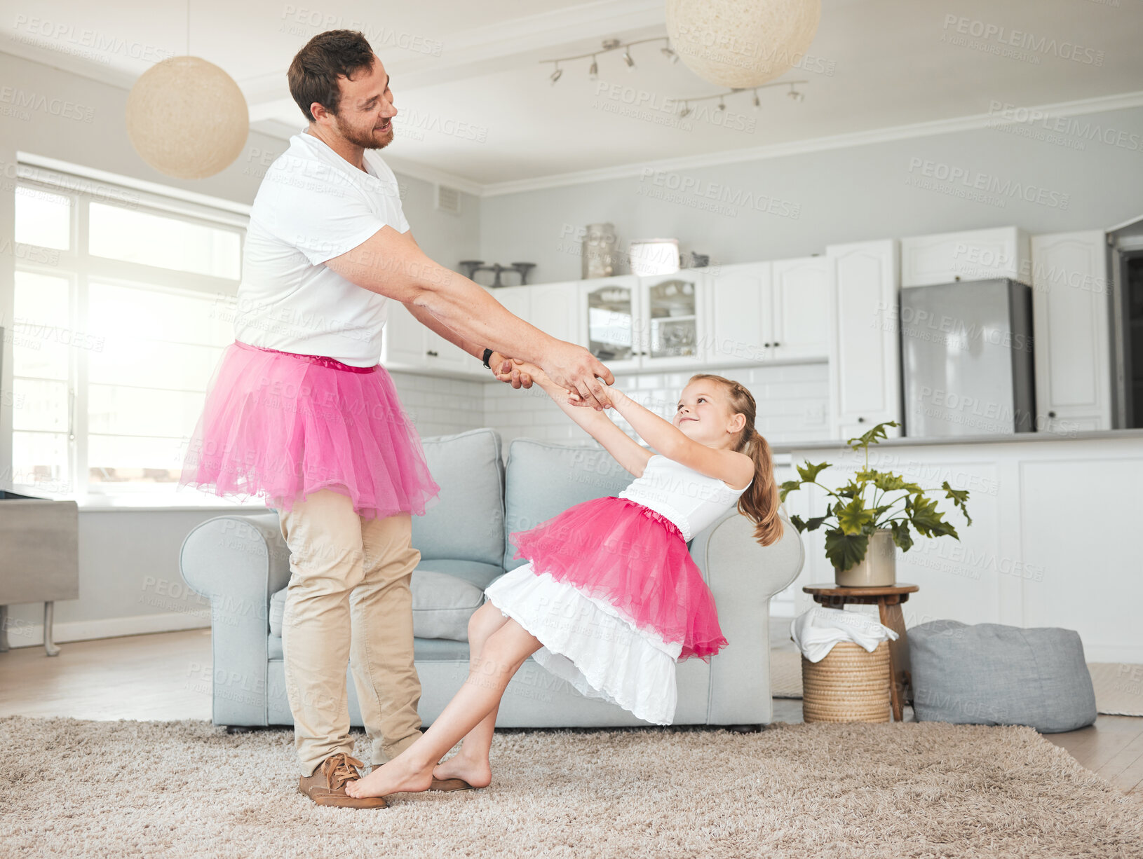 Buy stock photo Father, girl and family house for ballet, dancing and happy for holding hands with bonding in lounge. Man, dad and princess child with tutu, tiara and smile for play, memory or love at home in Italy