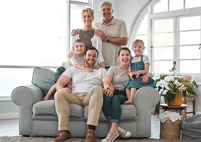 Buy stock photo Shot of a happy family relaxing on the sofa at home