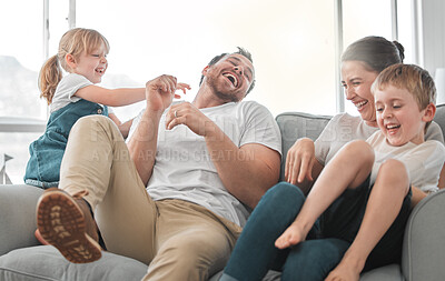 Buy stock photo Shot of a young couple spending time with their children