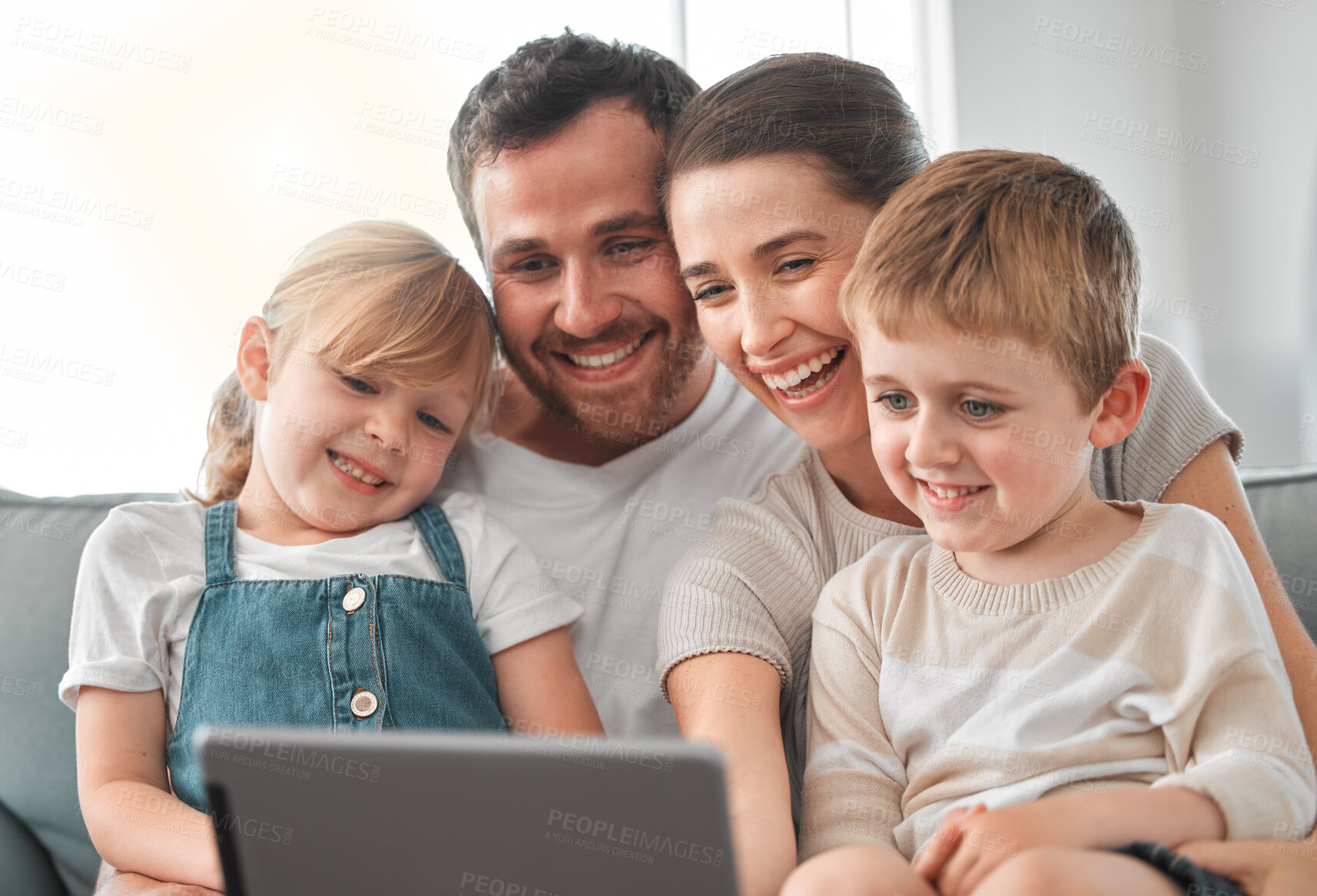 Buy stock photo Sofa, video call and parents with children on tablet for communication, contact and networking. Family, relax and mom, dad and kids on digital tech for relationship, talking and bonding in home