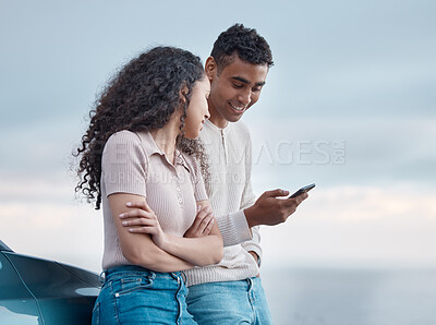 Buy stock photo Couple, phone and reading on road trip, holiday and search for direction on digital map with smile by ocean. Man, woman and happy with smartphone, scroll and outdoor for vacation on travel with app